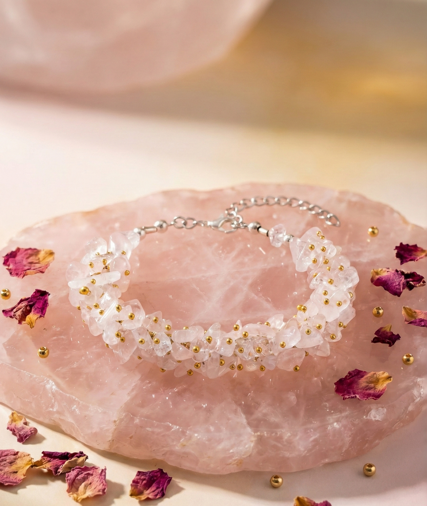 Bracelet with white floral design on a pink stone with dried flowers