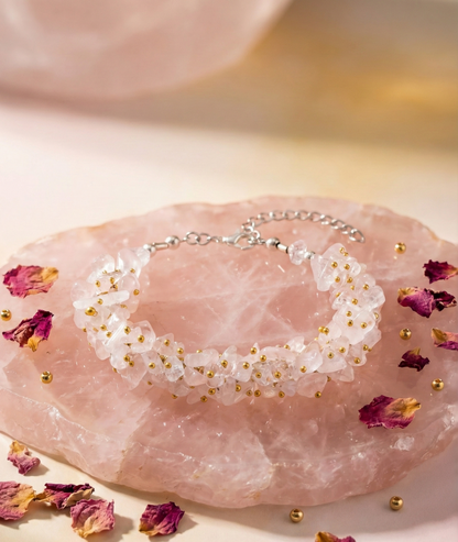 Bracelet with white floral design on a pink stone with dried flowers